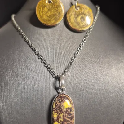 Stunning oval-shaped gemstone pendant, a Boulder Opal matrix & Earrings set