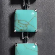 Sale Photo Thumbnail #24: Designer Silver Tone & Faux Turquoise Square Panel 7” Bracelet!

This auction is for a lovely bracelet. This measures 7” by ½" and has a weight of 32 grams. Super cute.