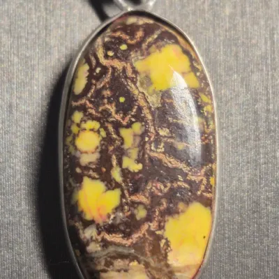 Stunning oval-shaped gemstone pendant, a Boulder Opal matrix & Earrings set