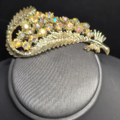 Sale Photo Thumbnail #11: Vintage BSK super sparkle Aurora Borealis Rhinestone BROOCH
> BSK produced until the 1960s from their NYC based factory.
Founded in 1948.
Brooch is in excellent condition, no loss of stones or damage ~ pin perfect