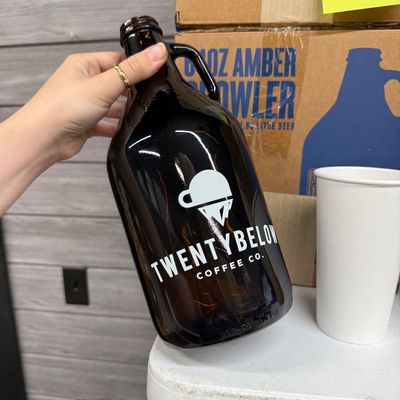 25 - Two Boxes of Amber Growlers
