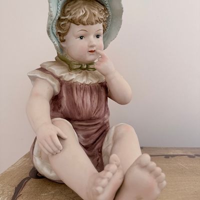 Sale Photo Thumbnail #106: Antique Bisque Porcelain Piano Baby Figurine