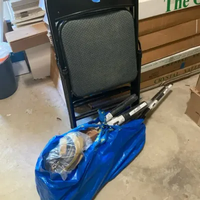 IKEA Bag Of Curtain Rods And 2 Folding Chairs
