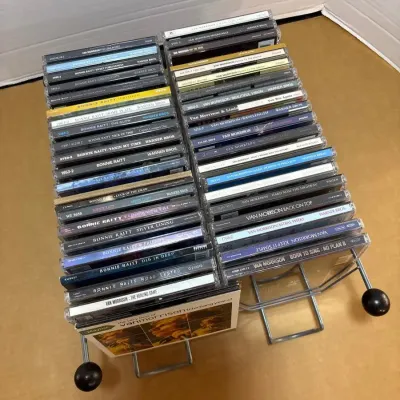 Van Morrison and Bonnie Raitt CDs with Holder