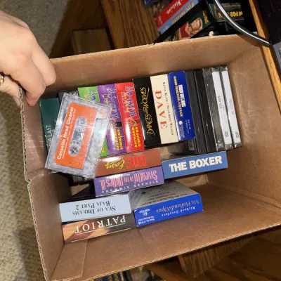Sale Photo Thumbnail #1341: VHS tapes, DVDs, player, etc.