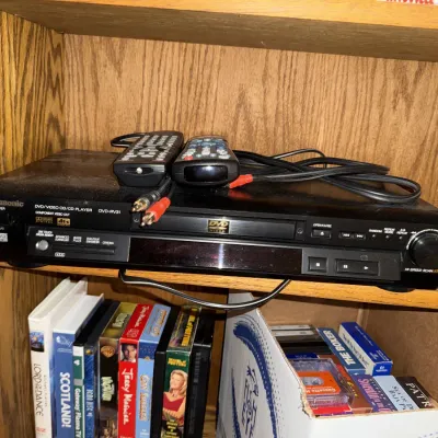 Sale Photo Thumbnail #1340: VHS tapes, DVDs, player, etc.