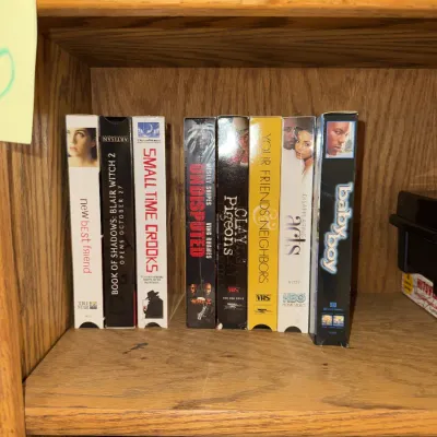 Sale Photo Thumbnail #1338: VHS tapes, DVDs, player, etc.