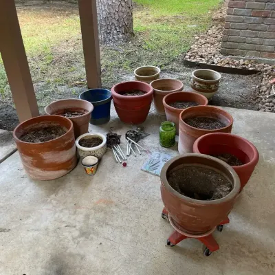 A Variety Of Planter Pots, Wind Chimes & Art