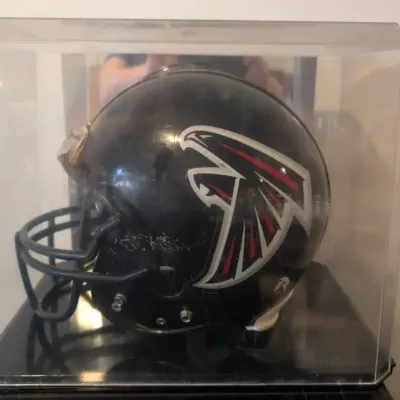 Riddell Atlanta Falcons collectible football helmet in display case