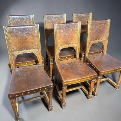 Sale Photo Thumbnail #110: Six arts crafts art nouveau leather embossed chairs