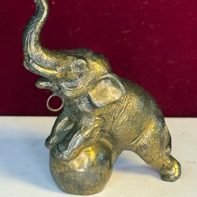 Sale Photo Thumbnail #8: Vintage solid brass miniature circus elephant good luck charm