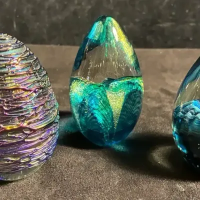 Sale Photo Thumbnail #168: Blue green and purple egg shaped paperweights