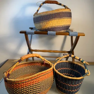 Sale Photo Thumbnail #179: A collection of bolga baskets luggage rack
