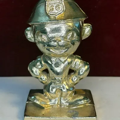 Sale Photo Thumbnail #24: Phillips 66 gold tone metal mascot figurine paperweight