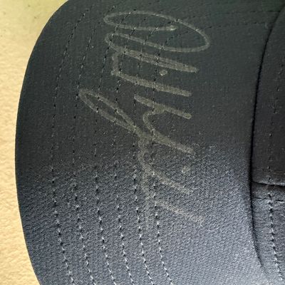 Sale Photo Thumbnail #431: This is a Callaway brand cap. The autograph is on the brim, in what appears to be metallic Sharpie, or other marker. This piece has not been authenticated. The size is believed to be large. Pre-auction estimate: $150-$300.