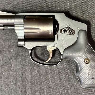 Sale Photo Thumbnail #423: This revolver is perfect for concealed carry. It is a lightweight five-round double action snub nosed revolver chambered in .38 special +P, with an enclosed snag-free hammer. Its weight is only 14.6 ounces (unloaded). It has a blued finish, and hard rubbe