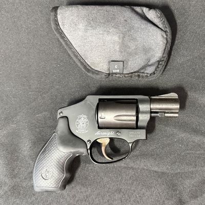 Sale Photo Thumbnail #421: This revolver is perfect for concealed carry. It is a lightweight five-round double action snub nosed revolver chambered in .38 special +P, with an enclosed snag-free hammer. Its weight is only 14.6 ounces (unloaded). It has a blued finish, and hard rubbe