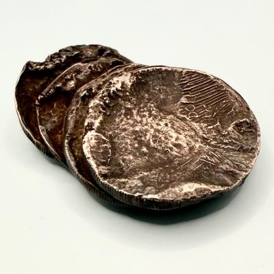 Sale Photo Thumbnail #428: This piece is believed to be six American constitutional silver coins fused together. Some appear to be Peace dollars. This was tested in multiple areas using the Niton XRF precious metals analyzer, and was determined to be 90% silver. The weight is 146 g