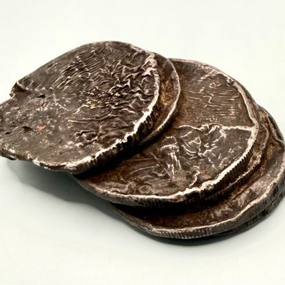 Sale Photo Thumbnail #427: This piece is believed to be six American constitutional silver coins fused together. Some appear to be Peace dollars. This was tested in multiple areas using the Niton XRF precious metals analyzer, and was determined to be 90% silver. The weight is 146 g