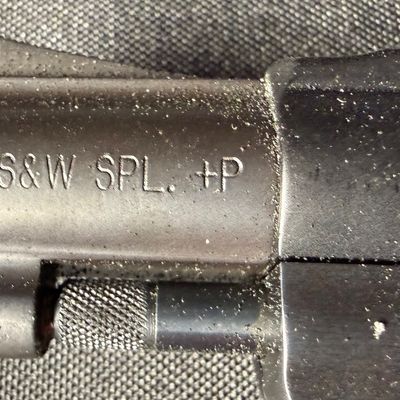 Sale Photo Thumbnail #424: This revolver is perfect for concealed carry. It is a lightweight five-round double action snub nosed revolver chambered in .38 special +P, with an enclosed snag-free hammer. Its weight is only 14.6 ounces (unloaded). It has a blued finish, and hard rubbe