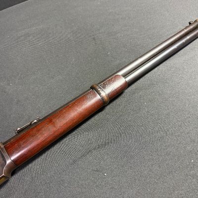 Sale Photo Thumbnail #451: This beautiful lever-action carbine is widely known as “The Gun That Won the West.” It features a 20-inch barrel, and holds 15 rounds of ammunition. It fires .44 Winchester Center Fire (.44-40) caliber ammo, a revolutionary round that could be used in