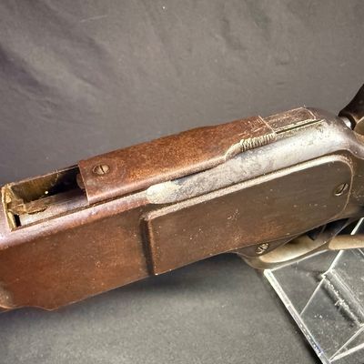 Sale Photo Thumbnail #448: This beautiful lever-action carbine is widely known as “The Gun That Won the West.” It features a 20-inch barrel, and holds 15 rounds of ammunition. It fires .44 Winchester Center Fire (.44-40) caliber ammo, a revolutionary round that could be used in