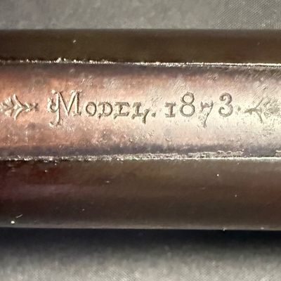 Sale Photo Thumbnail #449: This beautiful lever-action carbine is widely known as “The Gun That Won the West.” It features a 20-inch barrel, and holds 15 rounds of ammunition. It fires .44 Winchester Center Fire (.44-40) caliber ammo, a revolutionary round that could be used in