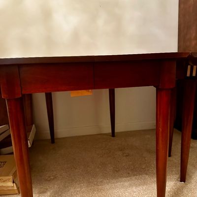 Sale Photo Thumbnail #2: Beautiful vintage Willett dining room set featuring a long, rectangular dining table with two extension leaves and eight matching dining chairs.

The set has a clean, timeless mid-century modern/Danish-inspired aesthetic, with warm reddish-brown wood tone