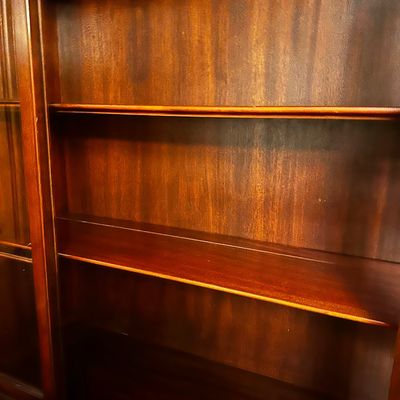 Sale Photo Thumbnail #34: traditional dark mahogany china cabinet featuring glass-paneled upper doors and multiple lower storage drawers.