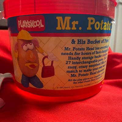 Sale Photo Thumbnail #34: 30 plus parts (including arms and earrings) for Mr and Mrs Potato Heads 
Mint condition
Bucket does not have lid.