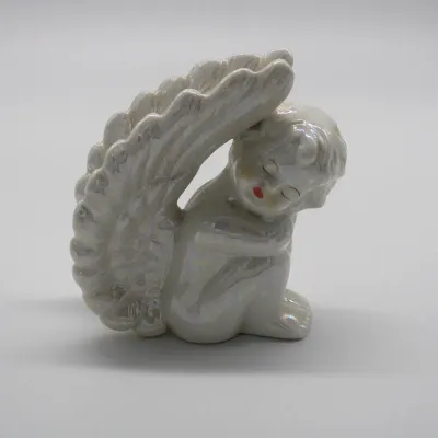 Vintage Iridescent Pearlized Ceramic Sleeping Cherub Angel Figurine
$20.00