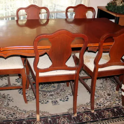 Cherry Wood Dining Set w/ 6 Chairs
$150.00
63in. x 38in. x 29in.

Bottom of some of the chairs does have ware on them.