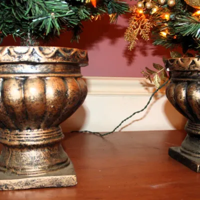 Small Pre-Decorated Tabletop Christmas Tree Set in a Bronze Urn-Style Base
$70.00
14in x 14in. x 36in.

- Set of 2
- Pre-Decorated
- Pre-lit