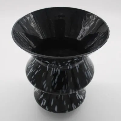 Vintage BX Glass Vase
9in. Tall
$40.00
- White designs all throughout the vase.