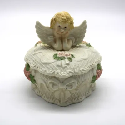 Vintage Heart-Shaped Porcelain Trinket Box w/ Lid
$30.00
- Embossed Lattice Pattern
- Pink Rose Accents
- Sculpted Cherub Angel Lid
