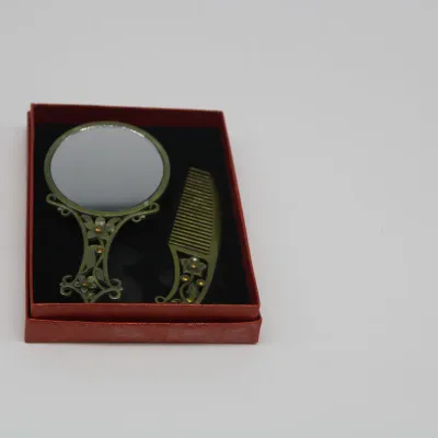 Vintage Bronze hand mirror + Comb set 
$20.00
