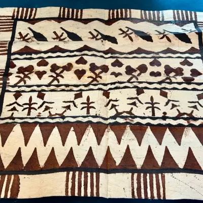 traditional Fijian masi (tapa bark cloth) featuring hand-painted geometric and tribal motifs