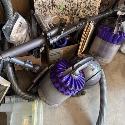 Sale Photo Thumbnail #189: Three carpet cleaners and two Dyson Vacuums.