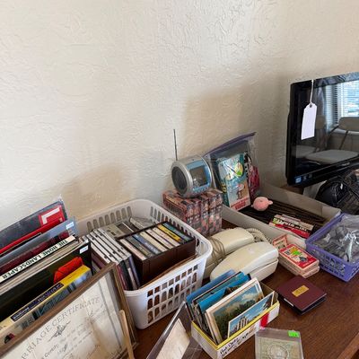 Sale Photo Thumbnail #84: Records, TVs, Cassettes, Books, VHS, and more. 

Cabinet and table not included.