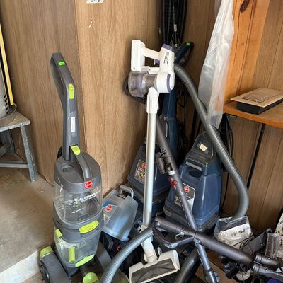 Sale Photo Thumbnail #187: Three carpet cleaners and two Dyson Vacuums.