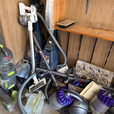 Sale Photo Thumbnail #186: Three carpet cleaners and two Dyson Vacuums.