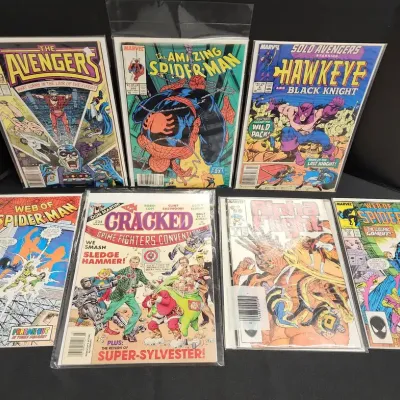 7 Comic Books - The Avengers, The Amazing Spider-Man, Hawkeye, Alpha Flight , X Factor, Marvel