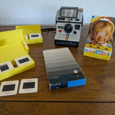 Vintage Polaroid OneStep Land Camera Lot w/ Q-Light Flash, Type 107 Film, Flashcubes & Slides