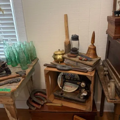 Green Coca-Cola bottles on primitive painted table