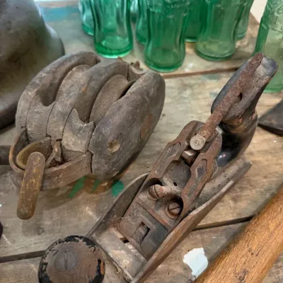 Antique wooden pulley block and cast iron hand plane