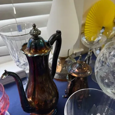 Iridescent glass coffee pot with figural finial