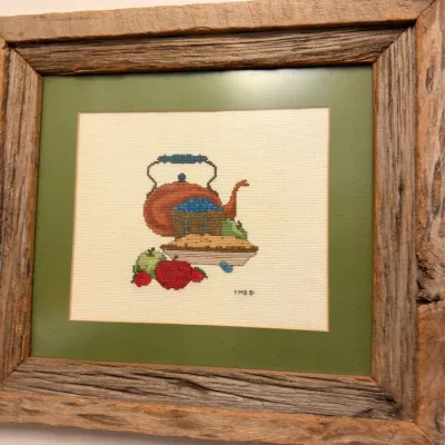 Framed needlepoint teapot in rustic barnwood frame