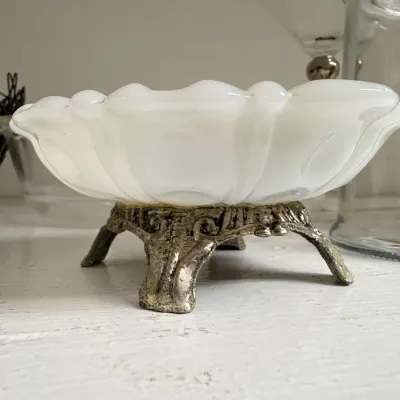 Milk glass bowl on ornate metal base