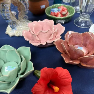 Ceramic flower figurines including red hibiscus