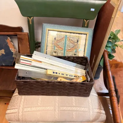 Basket of vintage folding rulers and yardsticks